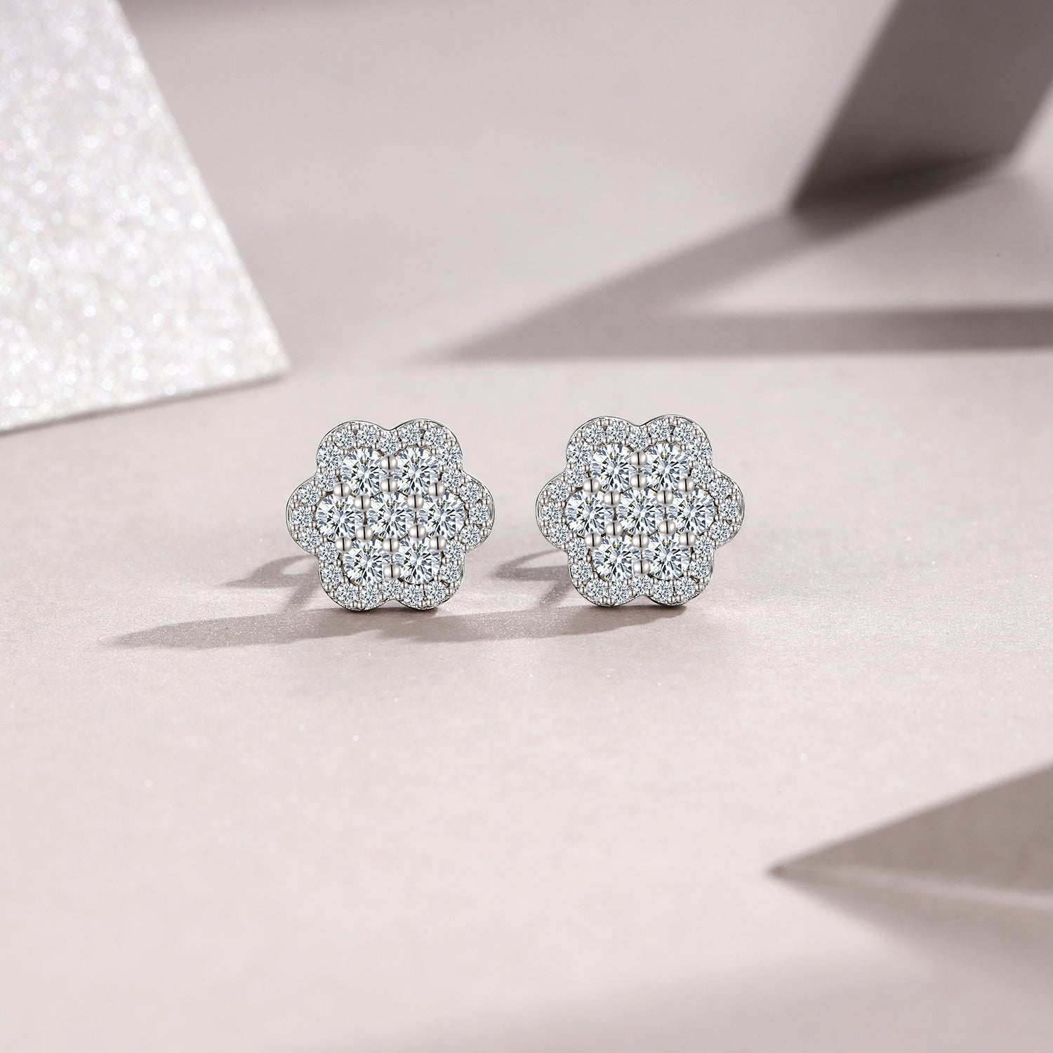 A Luxurious And Fashionable Flower Shaped Earring Set Featuring Top-quality Moissanite Stones, Made Of S925 Silver Electroplated With Platinum.