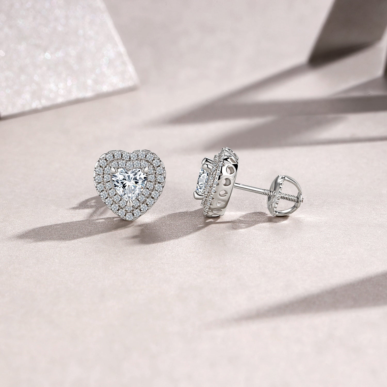 A Luxurious And Fashionable Heart Shaped Earring Set Featuring Top-quality Moissanite Stones, Made Of S925 Silver Electroplated With Platinum.